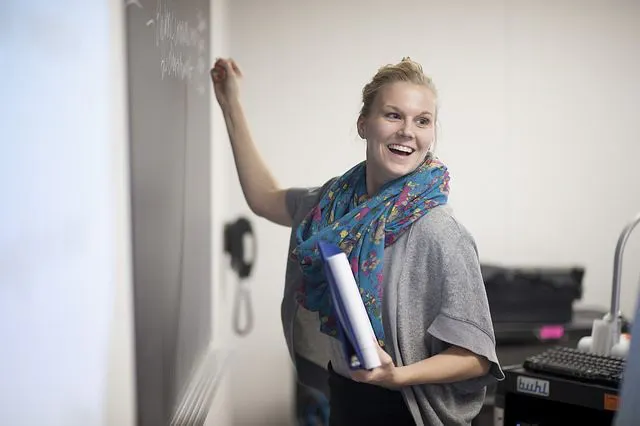 Student at white board