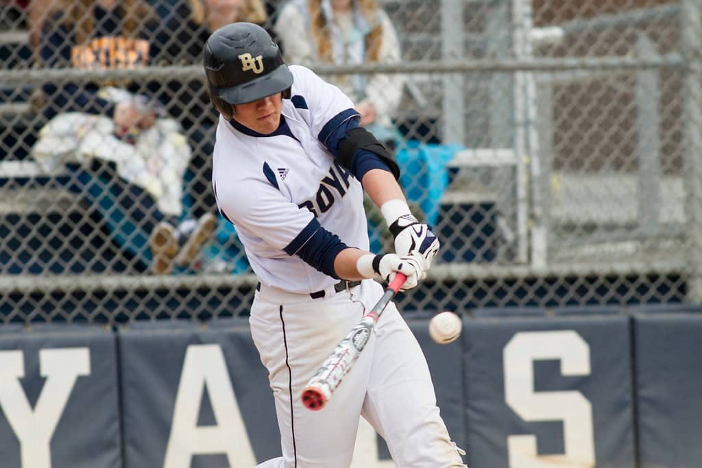 baseball player hitting a ball