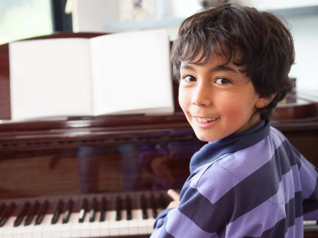 a young boy at the piano
