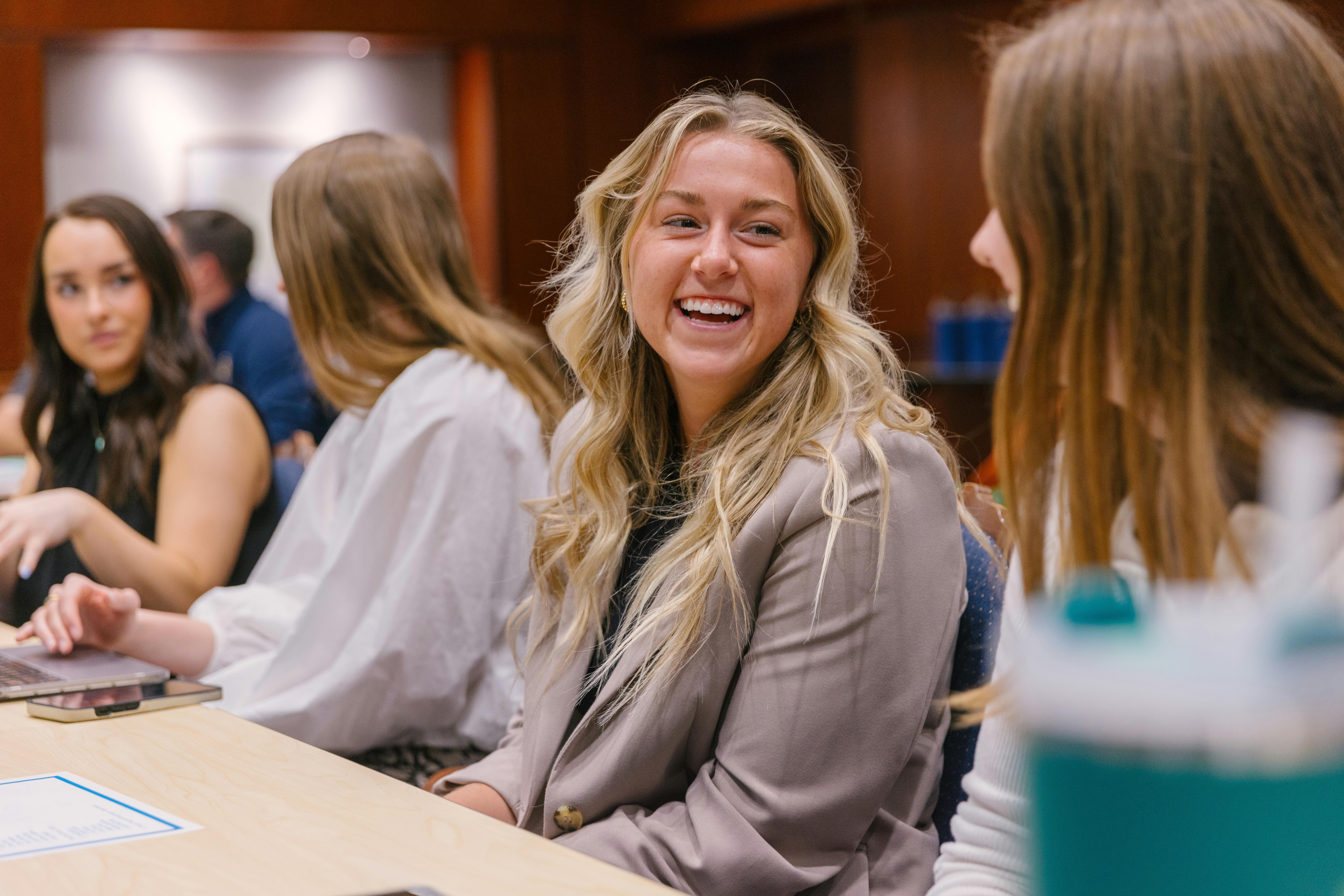 A student smiles in class