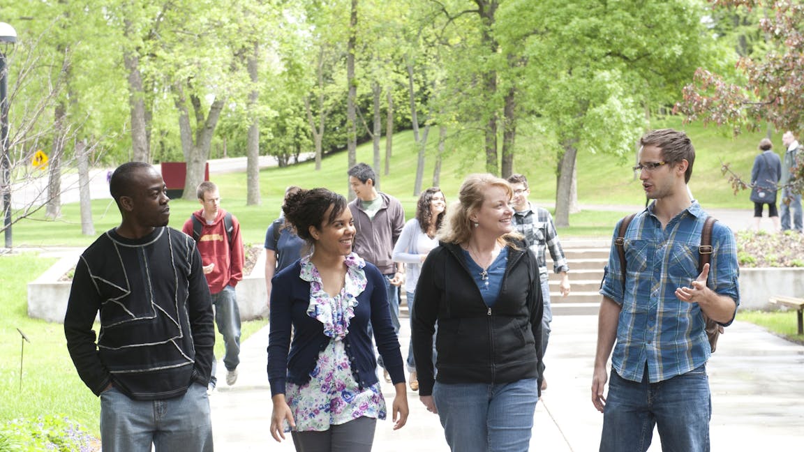 A group of seminary students walking outside.