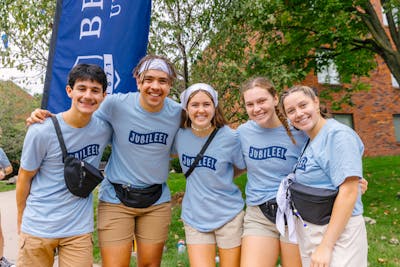 Five students smiling