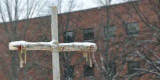 Cross in the snow on campus