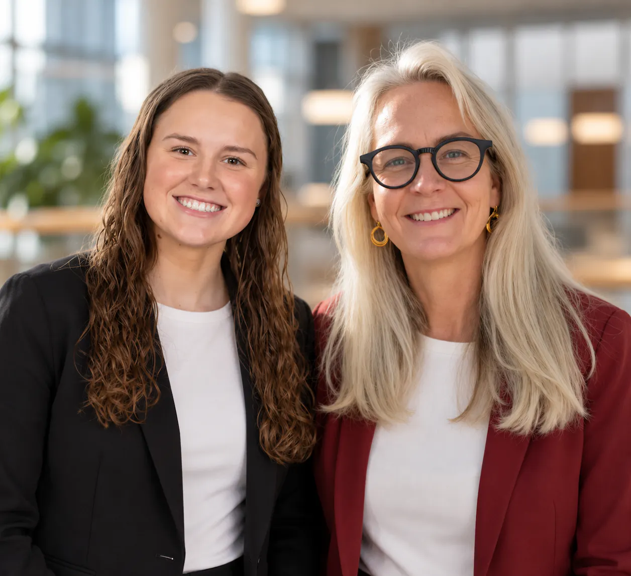 A Professor and her female student stand side by side.