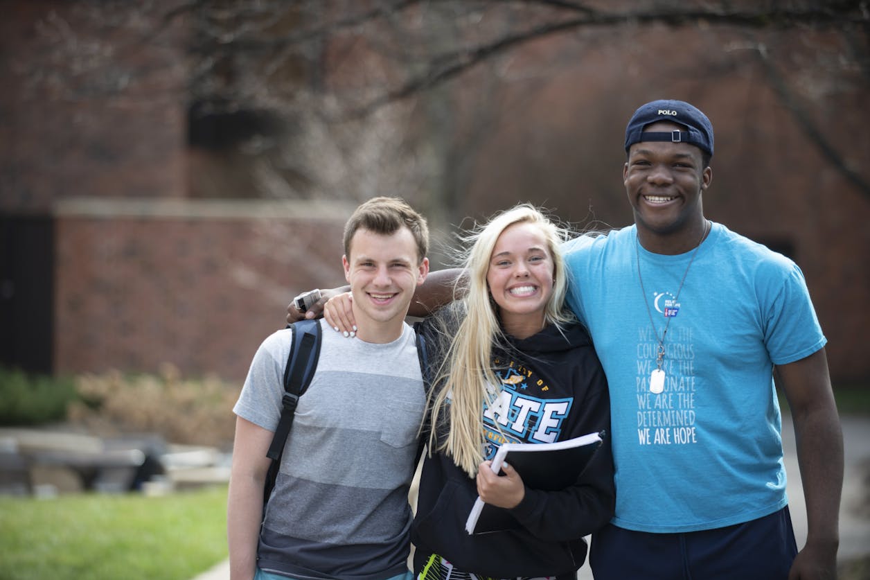 Three students on campus during Bethel Buisness Academy camp.