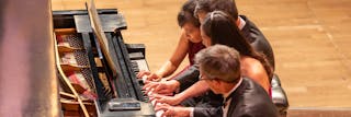 Quartet of 4 faculty at one piano