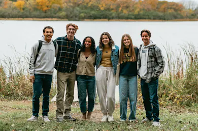 Smiling student wearing Bethel University beanie