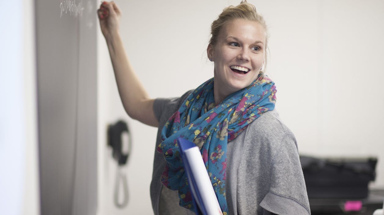 A student participates in a class activity.