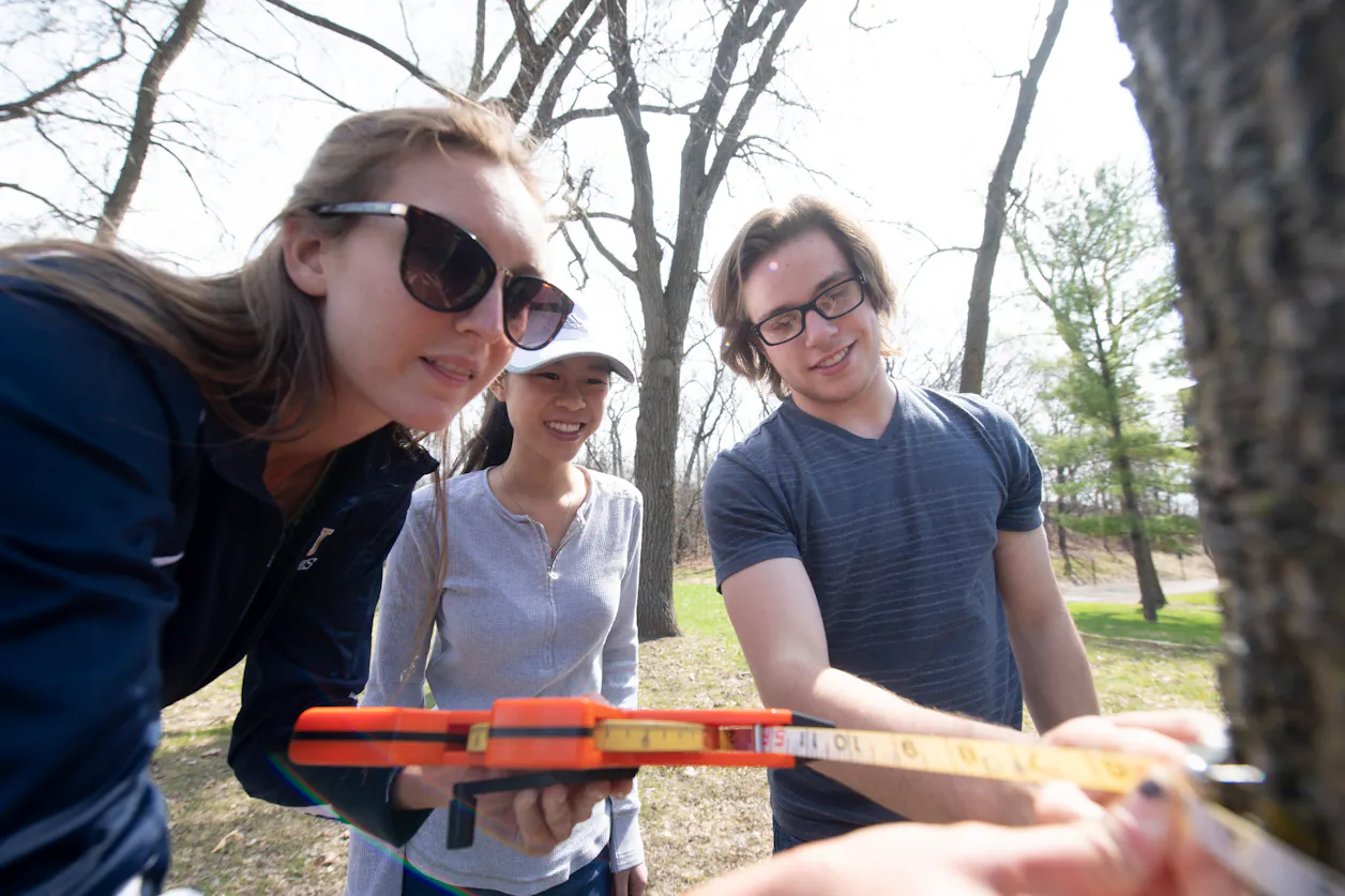 Students in BIO 126/127 determine tree height using a clinometer and tree girth using a Diameter at Breast Height (DBH) tape.