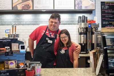 BUILD students David Kaetterhenry and Kirsta Graf at their internship at Dunn Brothers Coffee