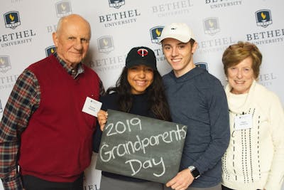 Bethel students and grandparents smile for a photo