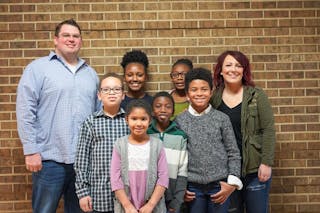 Lucy Swanson poses for a picture with her family. Swanson graduated from Bethel's College of Arts and Sciences and Bethel Seminary.