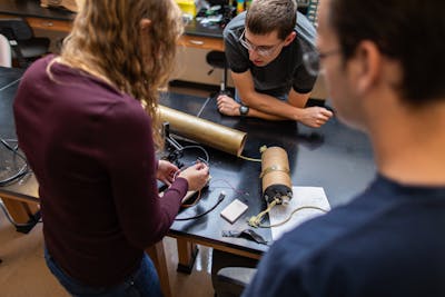 Rocket Club members assemble components in Bethel's Electrical Engineering Lab