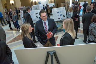 Bethel students present their research in the rotunda at the Minnesota state capitol building.
