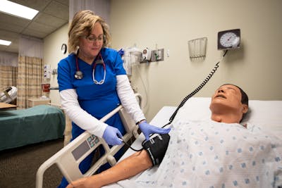 Student Shirlene Schmidt in one of Bethel's nursing simulation labs