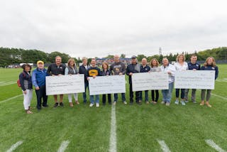 Proponents of the four winning proposals received checks for their groups before the September 7 football game.
