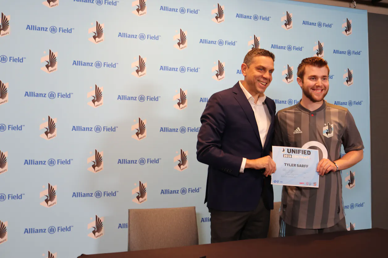 BUILD student Tyler Sarff stands next to Manny Lagos, Sporting Director of the Minnesota United FC (Photo courtesy of Special Olympics Minnesota)