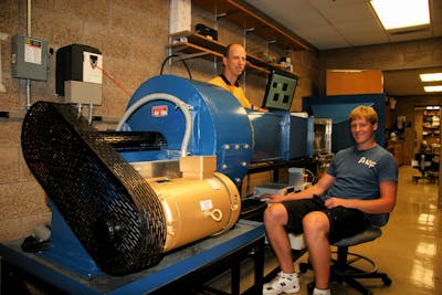 Underland as a student, working with Professor of Physics Keith Stein on the installation and refurbishment of Bethel's wind tunnel during the summer of 2010.