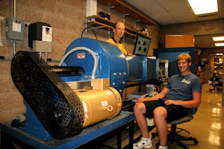 Underland as a student, working with Professor of Physics Keith Stein on the installation and refurbishment of Bethel's wind tunnel during the summer of 2010.
