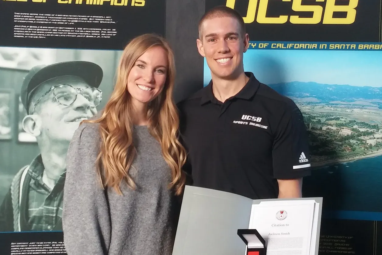 Smidt and his wife, Chelsea, stand for a photo after Smidt is presented the American Red Cross' Certificate of Merit.