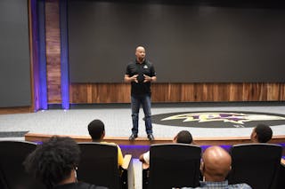 Steve Fitzhugh GS'23 speaks at the Baltimore Ravens' headquarters.