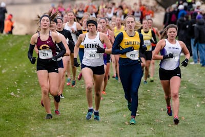 The Dye scholarship has given Anna Hage ’21 (second from left) the financial freedom to participate in track and field, where she regularly wins medals while strengthening her spirit. 