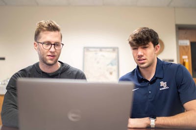 Associate Professor of History Charlie Goldberg and Zach Haala ’23