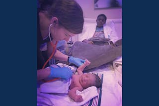 Rachel Hanus GS’17 at a birth that she attended as a midwife for an ESTHER Homes family. 