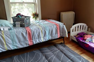 A bedroom prepared for a new ESTHER Homes family.