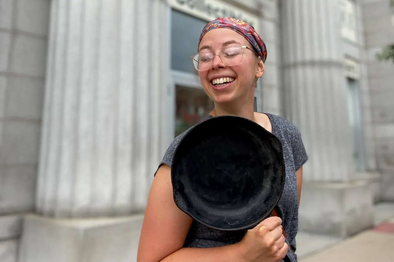 Ranae Pageler with a cast iron frying pan