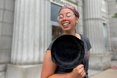 Ranae Pageler with a cast iron frying pan