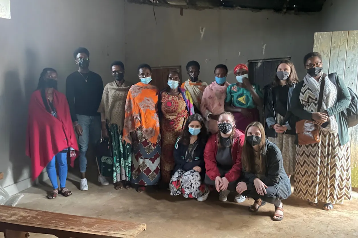 Study abroad group visiting an organization for survivors and wives of survivors of the 1994 genocide