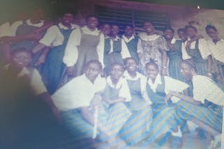 During the civil war in Liberia, Annetta Nyanama spent several years teaching in a refugee setting. She’s pictured here with some of her students. 