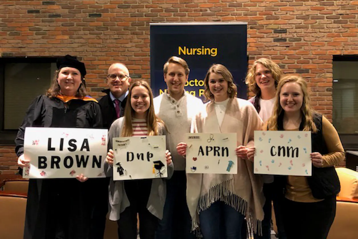 Lisa Brown, Bethel University graduate, with her family