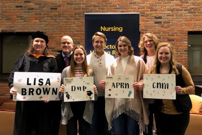 Lisa Brown, Bethel University graduate, with her family
