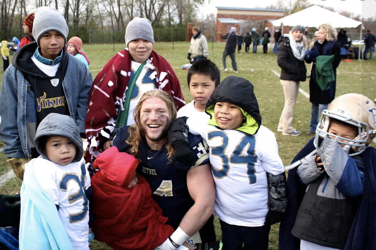 Jesse Phenow after a Bethel football game with his K’nyaw family 