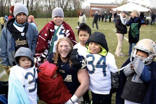 Jesse Phenow after a Bethel football game with his K’nyaw family 