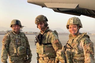 Maj. Katie Lunning with the two other members of the Critical Care Air Transport Team.