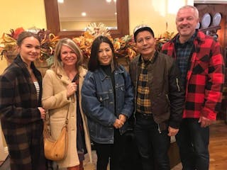 Melissa Serra S’23 (second from left) and her daughter Sophia introduce leaders from Asia Frontier Outreach to a local pastor. 