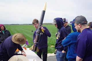A group inspecting rocket