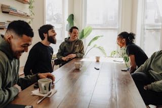 Dan Minea '14, center, and colleagues at Collective Chicago