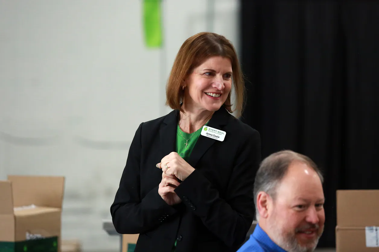 Every Meal Board Chair Jenna Soule chats with long-time supporters during a tour of the nonprofit's warehouse.