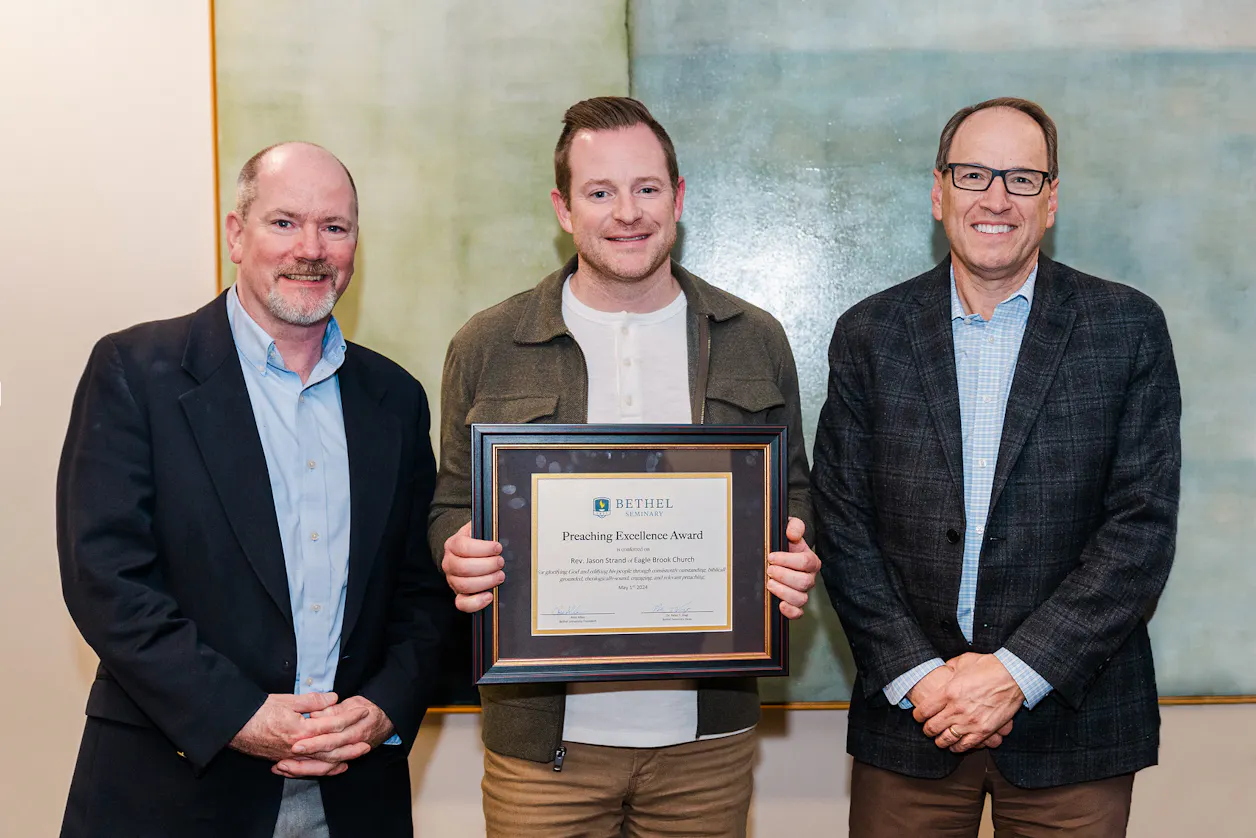 Bethel Seminary Dean Peter Vogt and Bethel President Ross Allen awarded Eagle Brook Senior Pastor Jason Strand ’01, S’07 the Preaching Excellence Award at the Preaching Showcase on May 1, 2024. 