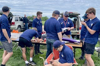 Photo of BU Rocket team preparing their rockets on launch day, held at Tripoli Minnesota Launch Site, North Branch, Minnesota. 