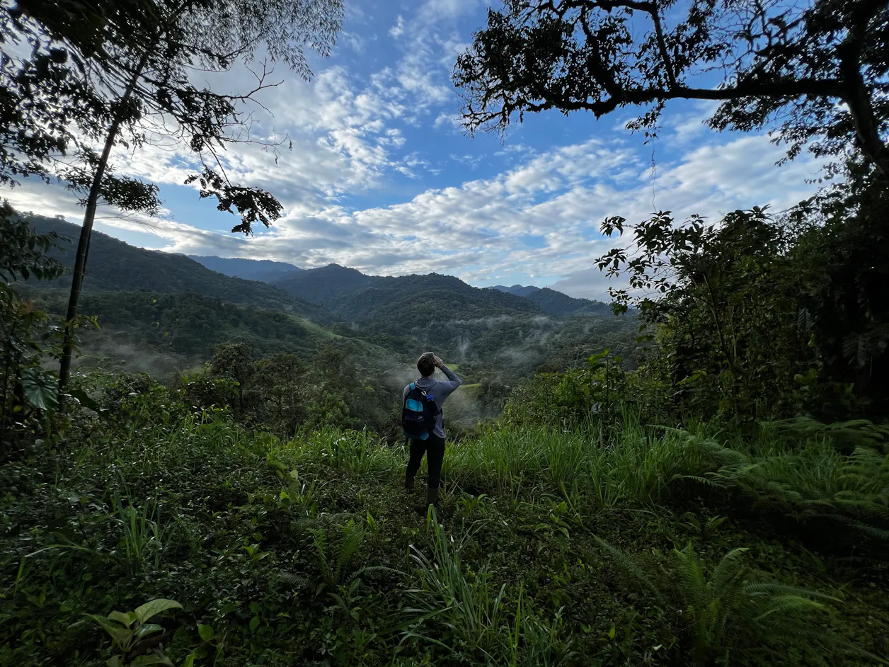 Biochemistry and chemistry double-major Ben Ostlie ’25 bird-watching on the “Ecology in the Tropics” trip to Ecuador, January 2024