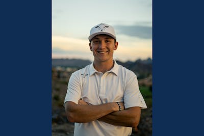 Adam Bricker, pictured in golf clothing that features a sheep. 