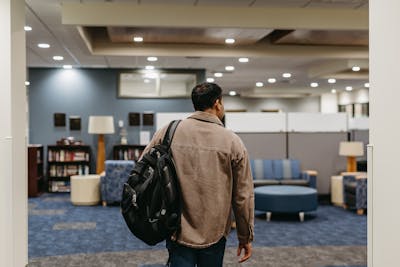 Alex Perla Castillo walks into Bethel Seminary