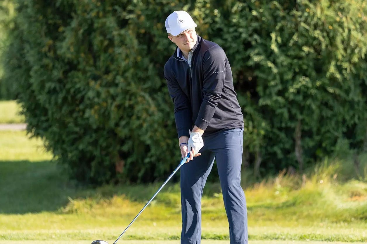 Bethel golfer lines up his shot on the course during a sunny fall day.