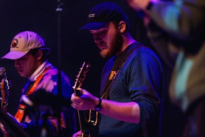 Boy playing guitar for worship