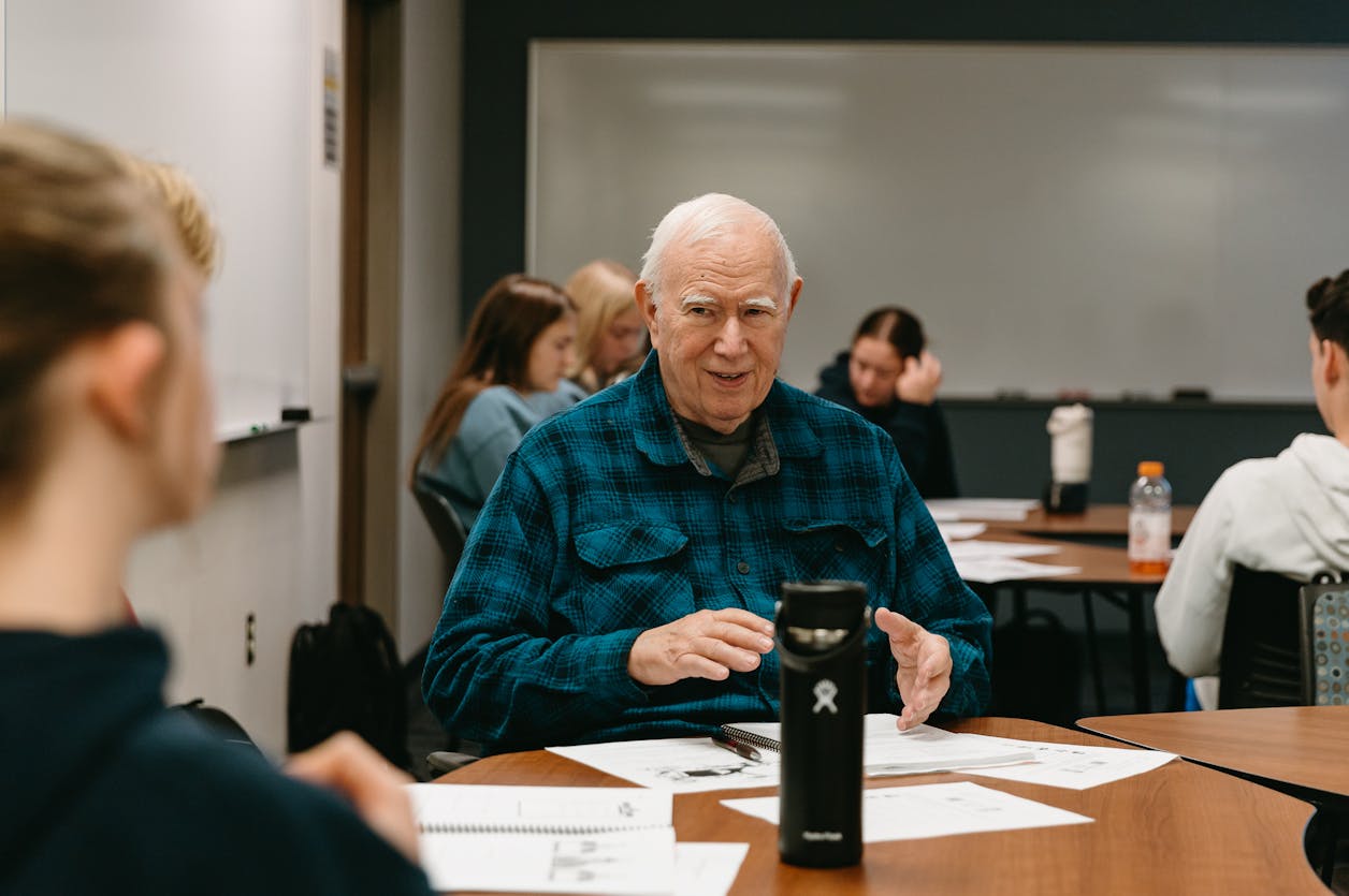 Curtis sitting in class with classmates